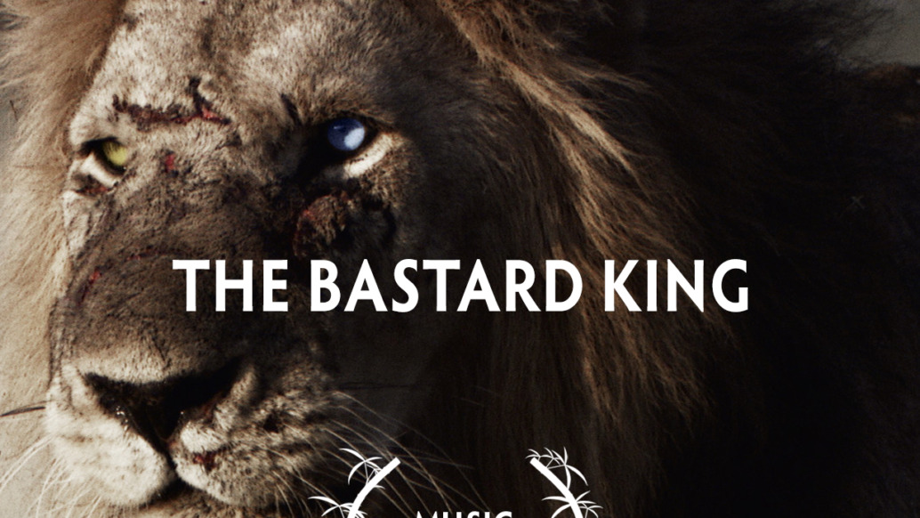 Close-up of a lion with scars and a piercing gaze. Text overlay reads The Bastard King. Below, a symbol resembling laurel branches encircles the words Music Award. With its gritty and dramatic tone, it's no wonder this piece secured a double win at Wildscreen Festival 2022.