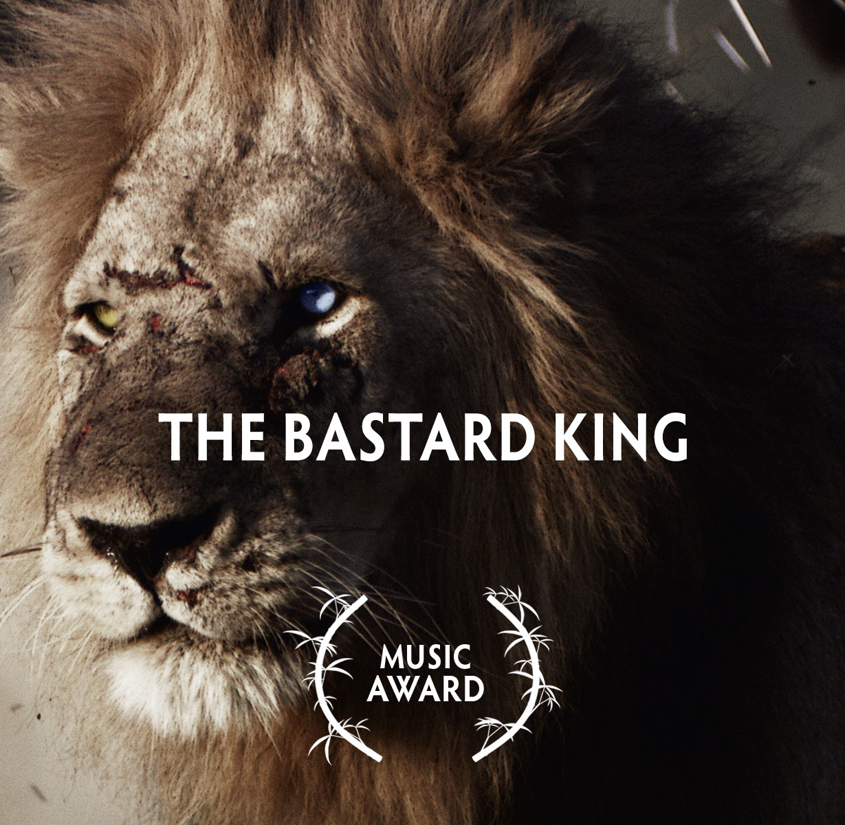 Close-up of a lion with scars and a piercing gaze. Text overlay reads The Bastard King. Below, a symbol resembling laurel branches encircles the words Music Award. With its gritty and dramatic tone, it's no wonder this piece secured a double win at Wildscreen Festival 2022.