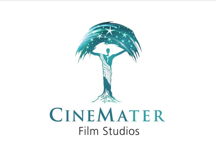 Logo for CineMater Film Studios featuring a stylized tree with a human figure as the trunk. The tree canopy is depicted with stars. As a theatrical label, the text CineMater is in teal, and Film Studios in black below. The background is white.