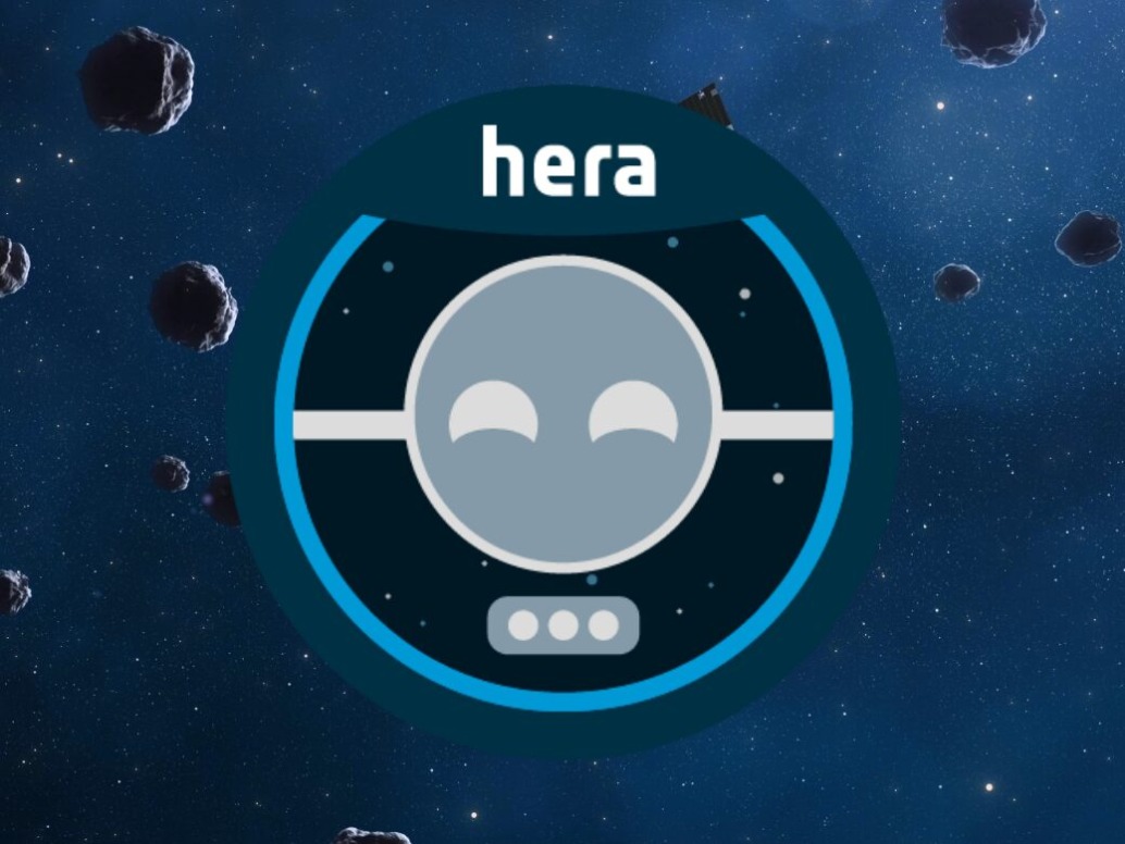 A circular logo with a stylized robotic face emerges on a space-themed backdrop, embodying the innovative spirit of corporate projects. The word "hera" crowns the top, while numerous floating asteroids dance across a starry blue sky.